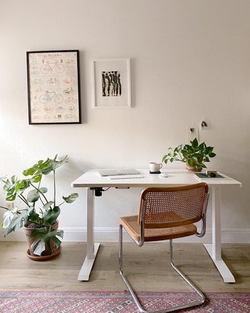 reviewer image of the white standing desk at a seated position