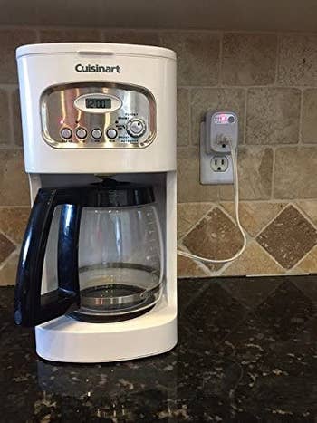 Coffee maker plugged in to the auto shut off attachment for the outlet