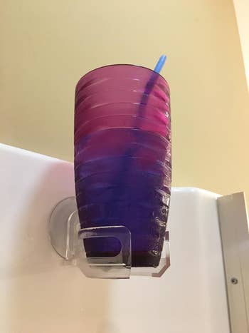 A reviewer's drink suctioned to their shower