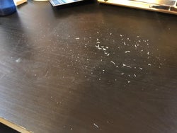 eraser shavings and dandruff on a desk