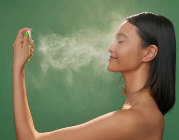 model spraying the mist on their face