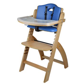 a wooden high chair with a blue seat and removable washable tray