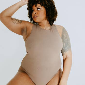 another model wearing the brown bodysuit, showing the bottom half