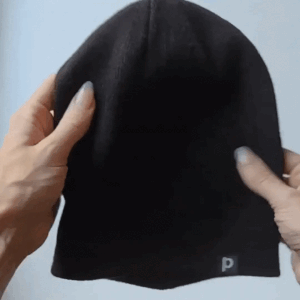 gif ot the beanie, showing how it opens in the back so you can wear a ponytail with it
