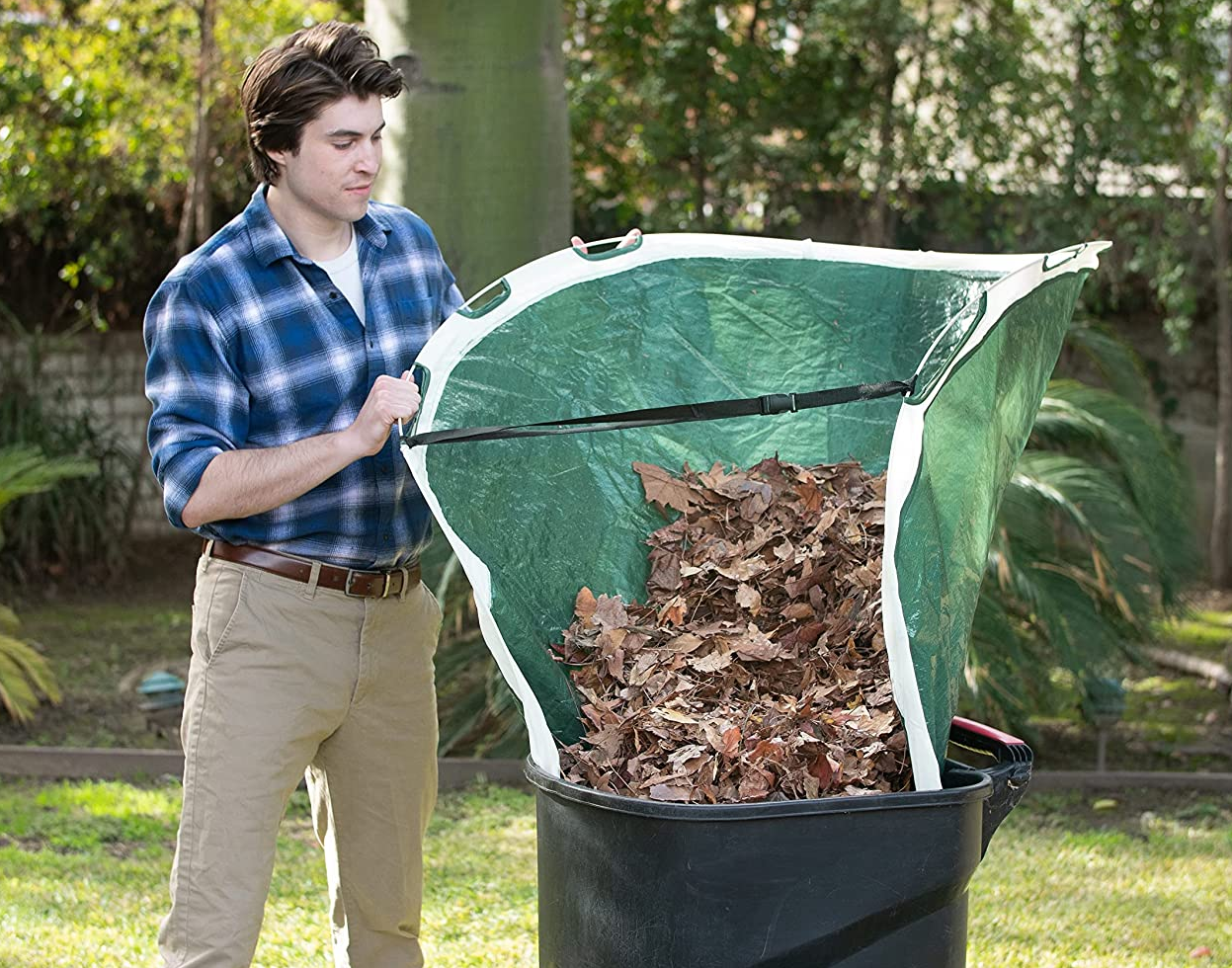a model using the tarp to funnel leaves into a trash can 
