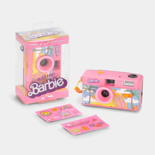 Barbie-themed film camera with packaging, featuring beach and palm tree design. Includes small accessory stickers