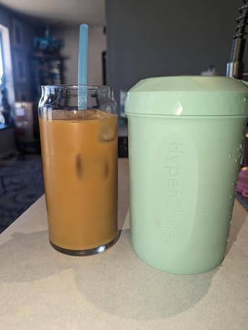 A chilled java successful a solid with crystal adjacent to a mint-colored HyperChiller connected a table