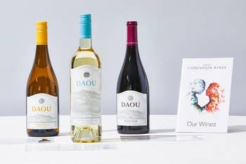 three bottles of wine, with a wine companion guide