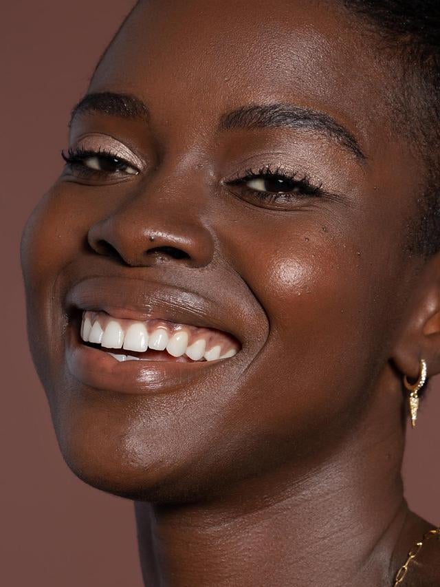 a model with subtle gold eyeshadow on