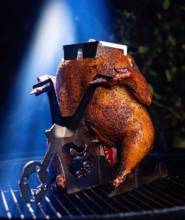chicken on a beer can roaster that looks like a motorcycle