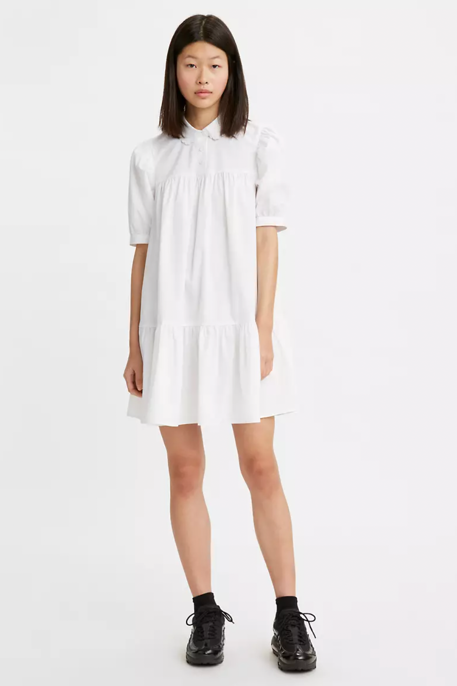 model wearing the dress in white