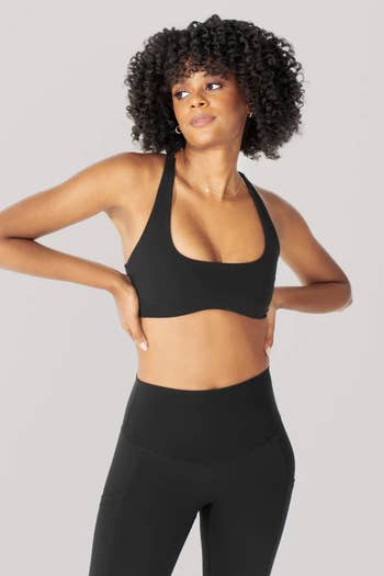 model wearing the black bra with matching leggings