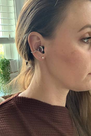a reviewer wearing the silver plugs