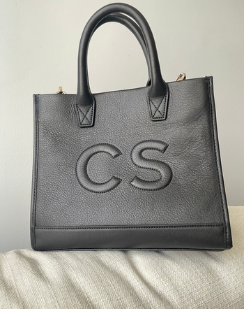 BuzzFeeder's black purse with