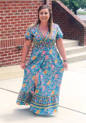 front view of reviewer wearing the blue floral print dress