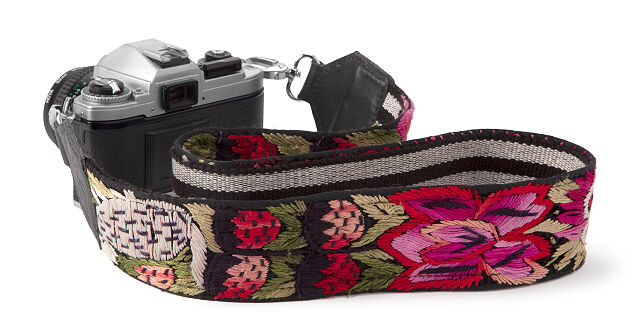 the embroidered strap attached to a camera