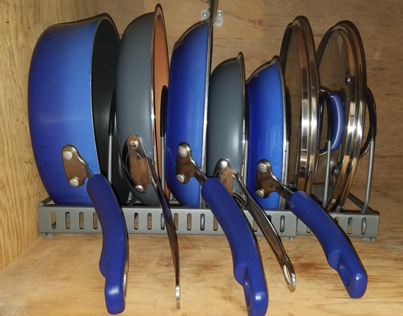 pans neatly organized on the holder