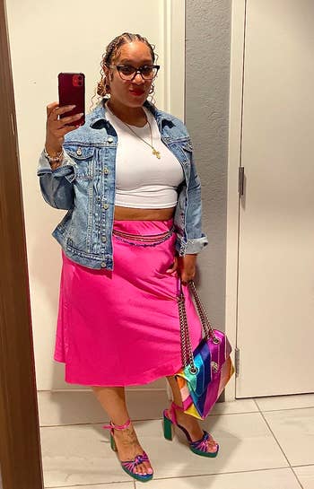 another reviewer wearing the pink skirt with a white top and denim jacket