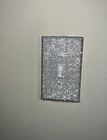 reviewer's light switch with the rhinestone cover over it