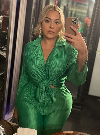 close-up of reviewer wearing the green pants set