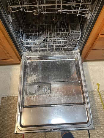 a reviewer's dishwasher looking dirty with hard water stains