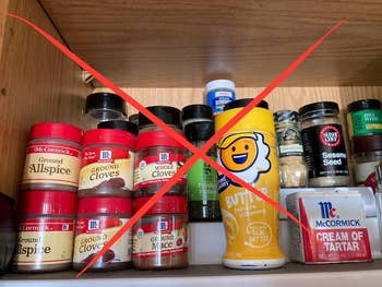 Pantry support with assorted spices and seasonings, including crushed cloves, allspice, and butter-flavored popcorn seasoning, crossed retired with a reddish X