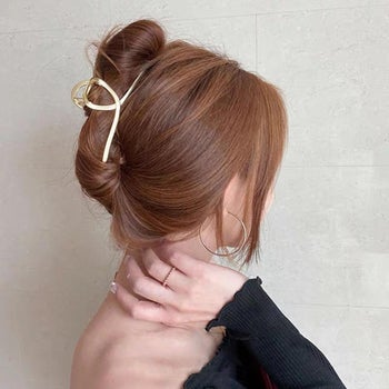 model wearing the ribbon hair clip in an updo
