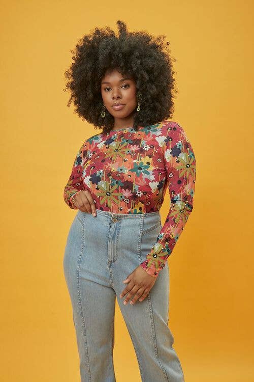 model wearing multi-colored floral shirt