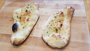 Naan bread on the stone 