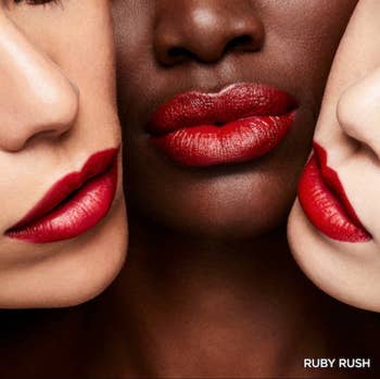 Three models showing the lipstick on all of their different skin tones