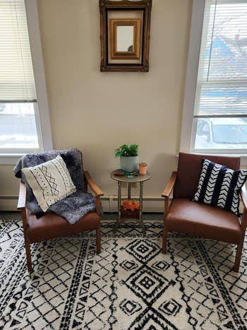 two fake leather chairs