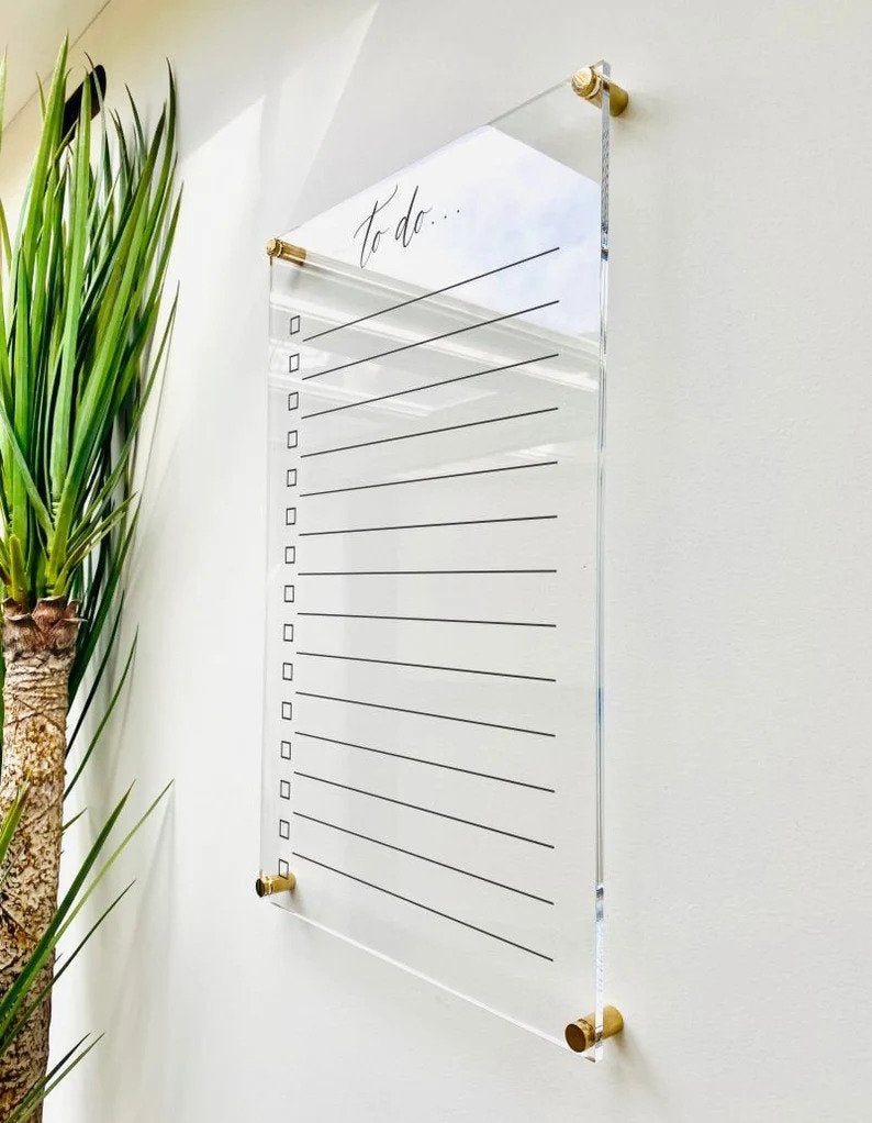 acrylic to-do list board mounted on wall