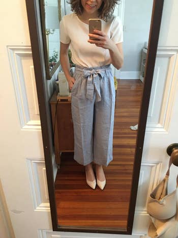 reviewer mirror selfie wearing blue paperbag pants