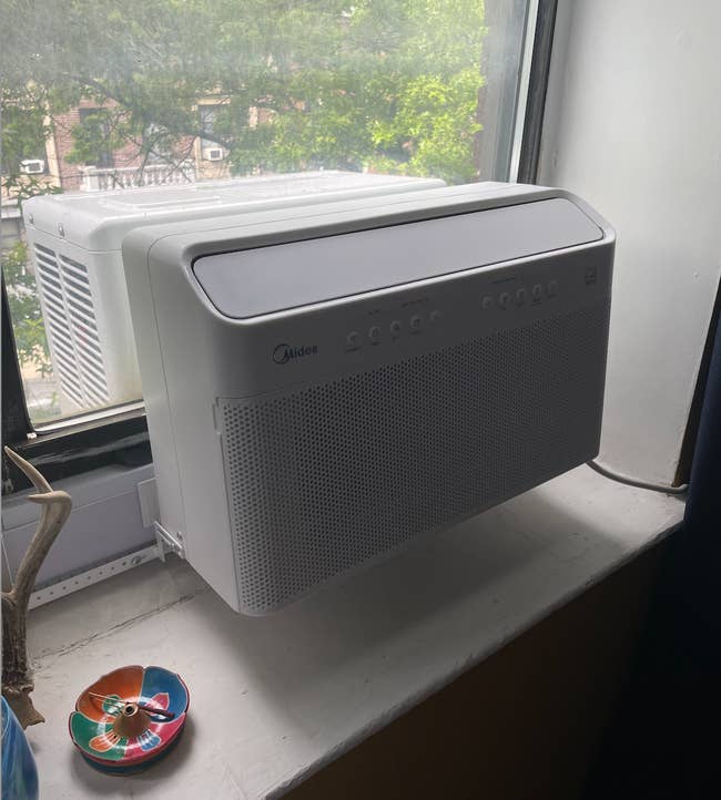image of the U-shaped air conditioner installed in a window