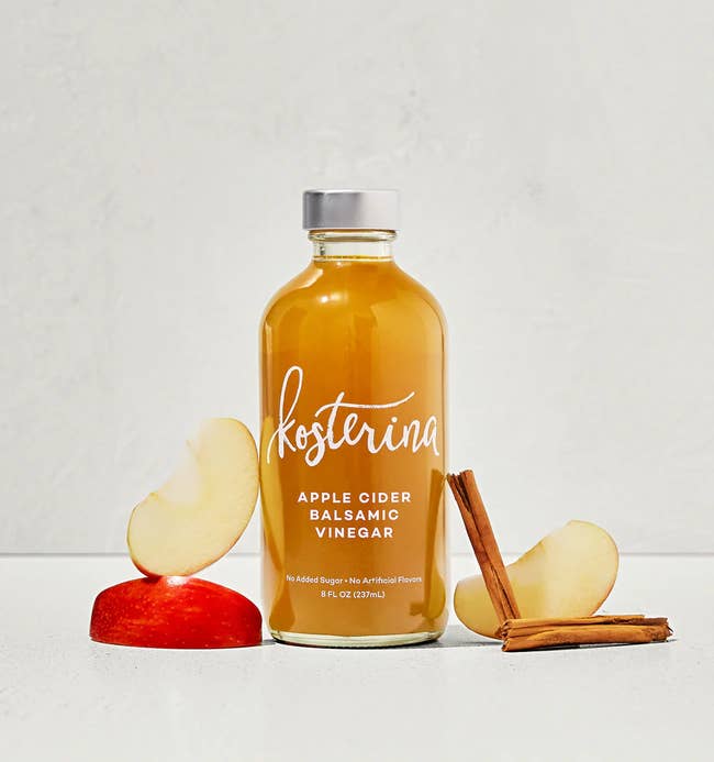 Kosterina Apple Cider Balsamic Vinegar bottle with apple slices and cinnamon sticks