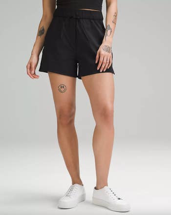 a model wearing the shorts in black
