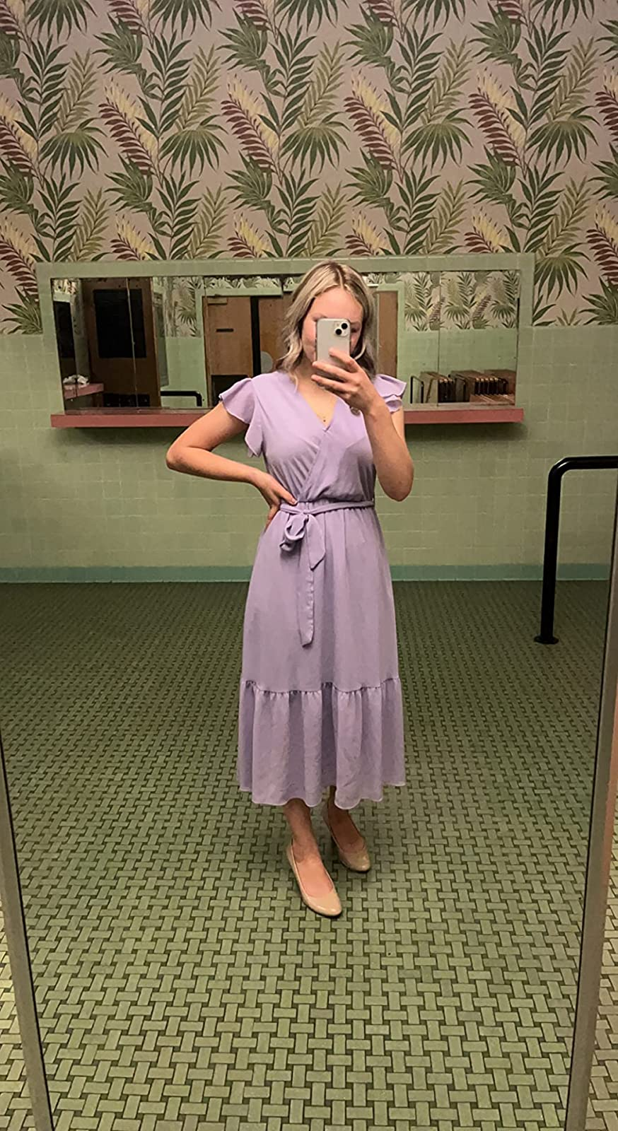 reviewer wearing a light purple dress with cream-colored flats