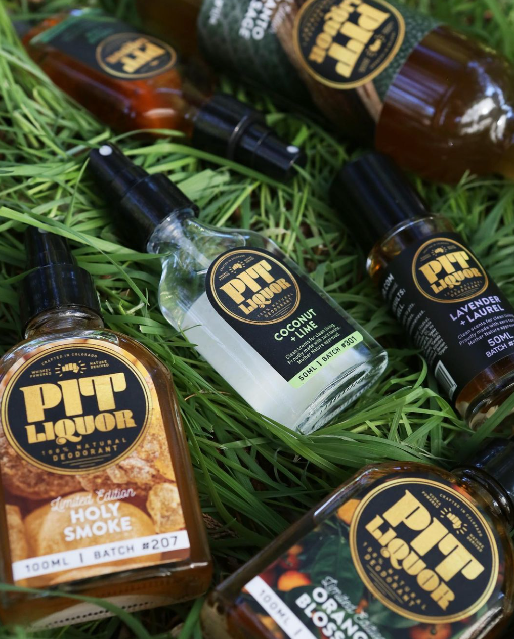 several bottles of product on the grass