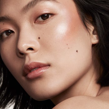 reviewer wearing shimmer skin stick