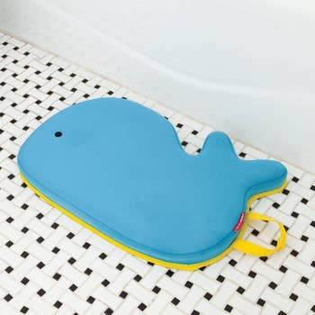 a blue whale-shaped kneeling pad