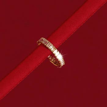 closeup of diamond ring on red ribbon