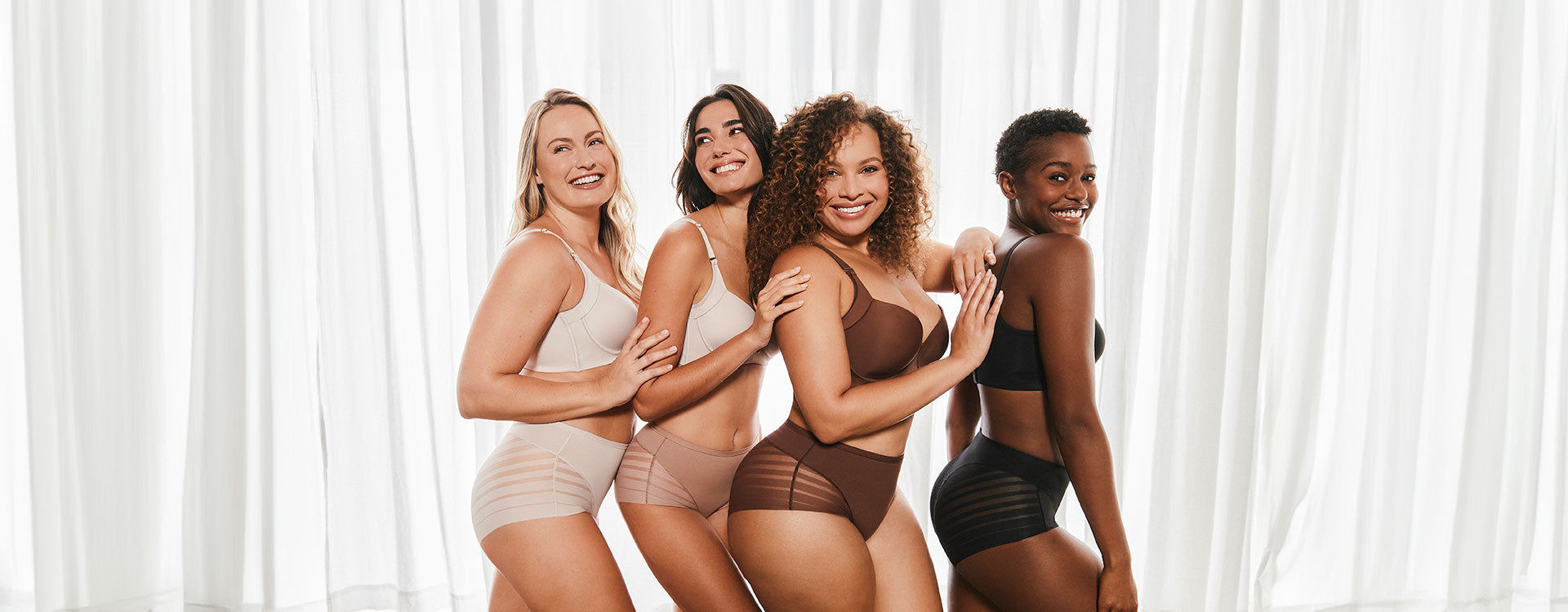 four models wearing antithetic  sizes and shades of the underwear