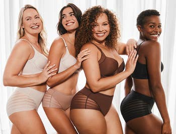 four models wearing antithetic sizes and shades of the underwear