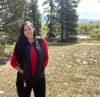 another reviewer wearing the black quilted vest