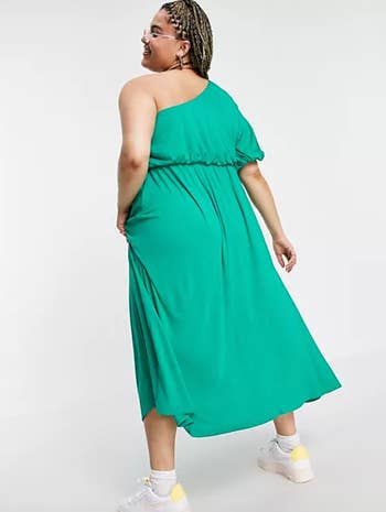 Model showing back of green dress