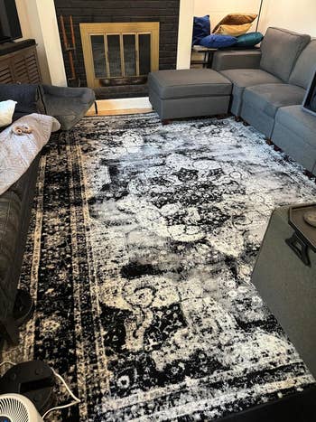 reviewer's black and white rug after cleaning with zero signs of staining