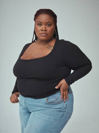 model wearing long sleeve bra top in black