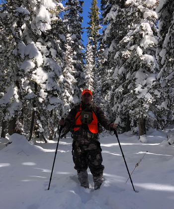 reviewer using poles in snow