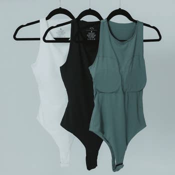 three bodysuits showing the padded bra