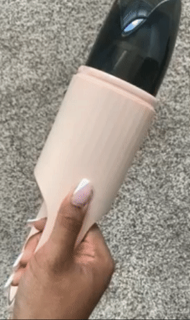 gif of reviewer turning on the pink vacuum